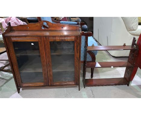 An Edwardian wall hanging shelf unit enclosed by 2 glass doors; a similar 3 height open shelf unit 
