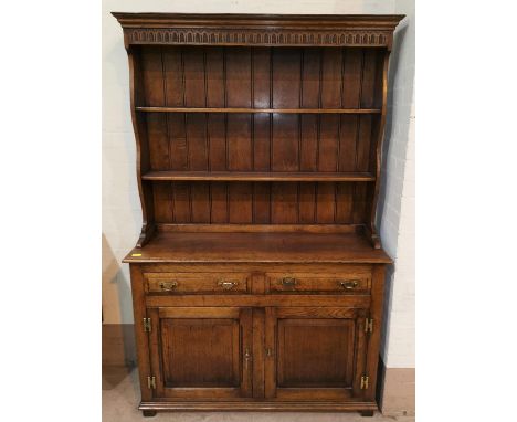 A golden oak Welsh dresser in the style of Titchmarsh &amp; Goodwin with double cupboard and 2 drawers 