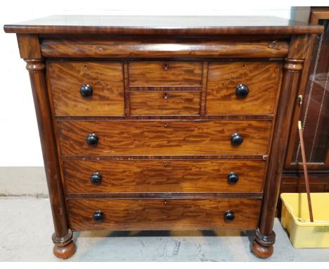 A 19th century "Scotch" chest with 3 long, 2 short and 2 deep drawers, turned side columns and feet, width 132 cm 