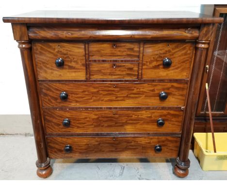 A 19th century "Scotch" chest with 3 long, 2 short and 2 deep drawers, turned side columns and feet, width 132 cm 