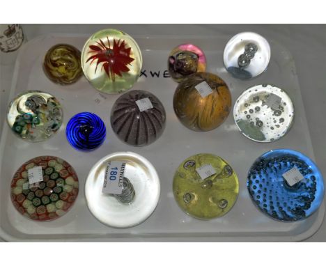 A collection of 13 glass paperweights, including Caithness 