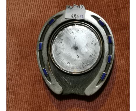 A novelty desk top barometer in horseshoe surround mounted with lapis lazuli coloured enamel 