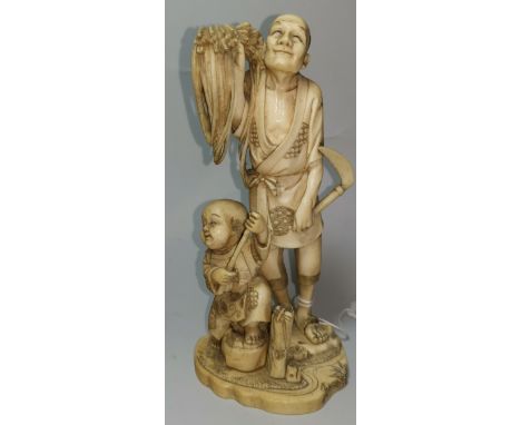 A late 19th century Japanese okimono figure group:  man with sickle and sheaf and boy with stick, character signature to base