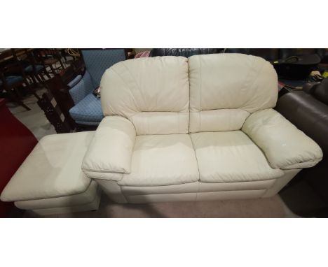 A cream leather 2 seater settee and matching pouffe 
