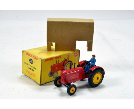 Dinky No. 300 Massey Harris Tractor with rubber tyres. Generally E to NM in G Box with insert. 