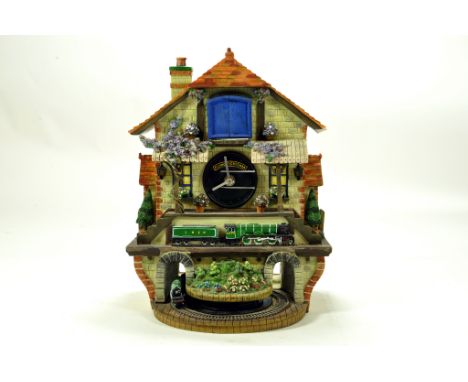 A fine presentation Cuckoo Clock, featuring the Flying Scotsman complete with Box.