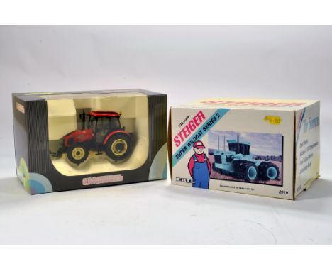 Universal Hobbies 1/32 Farm Issue comprising Zetor tractor plus Ertl Steiger Super Wildcat. E to NM in Boxes. (2)