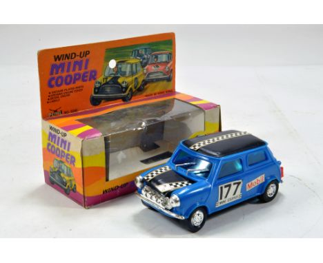 Petrel No. 9260 Plastic Large Scale Wind Up Mini Cooper, some light attention needed otherwise VG in Box.