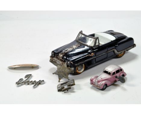 An interesting toy combination of a Minster tin plate car plus Chad Valley Clockwork Weekin issue and car badges. (6)