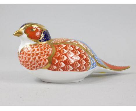 A Royal Crown Derby porcelain pheasant paperweight, gold button