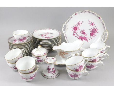 A Hutschenreuther porcelain part tea service, comprising cups, saucers, side plates, candle stick, covered sugar bowl, double