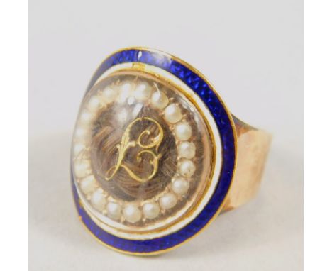 A Georgian memorial ring, the circular head with an outer blue enamel section and inner line of pearls, with a lock of hair a