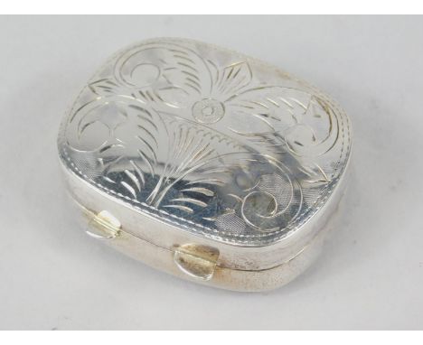 An early 20thC oval patch box, with thumb mould handle and plain interior, chased with fern leaves to the lid, white metal ma