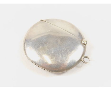 An Edwardian silver vesta case, of compressed rounded outline, with flush hinged lid and ring side hand with match strike bas