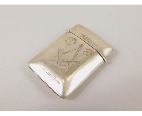 A Victorian silver Masonic related vesta case, of rounded outline with hinged lid and plain interior, the exterior decorated 