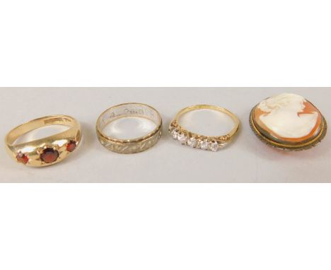 Miscellaneous jewellery, to include a 9ct and garnet gypsy ring, a white metal eternity ring stamped 9ct, a brooch with white