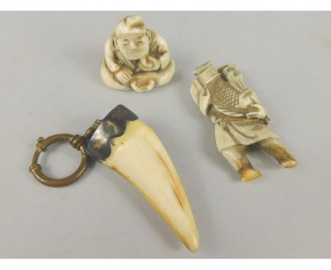 Two early 20thC netsuke, and a mounted tooth