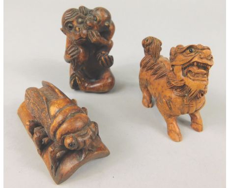 Miscellaneous wooden netsuke, to include a locust, a dog and pair of monkeys