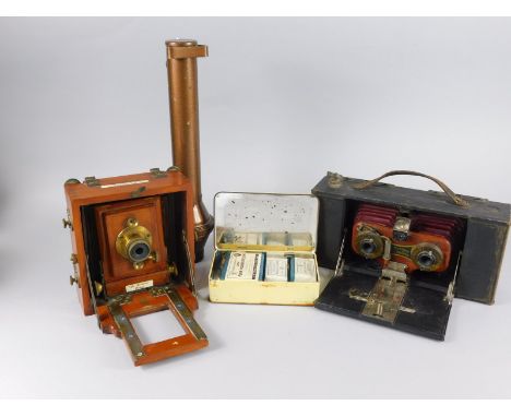 A late 19thC Jay Lancaster and Sons Birmingham plate camera, of small proportion with mahogany casing and brass centre, 16cm 