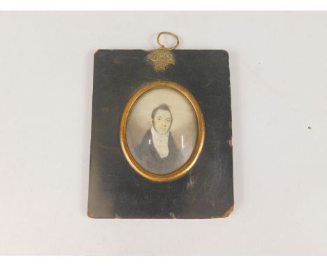 A late 18th/early 19thC miniature portrait of a gentleman, in ebonised frame, the oval portrait 6cm x 7cm