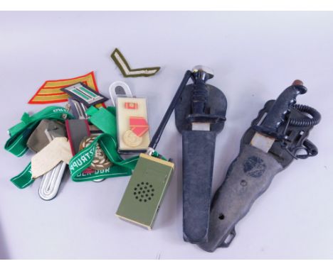 Various Army related and other war related badges etc., two sheathed daggers, 36cm high, one handle marked 'Playright', vario