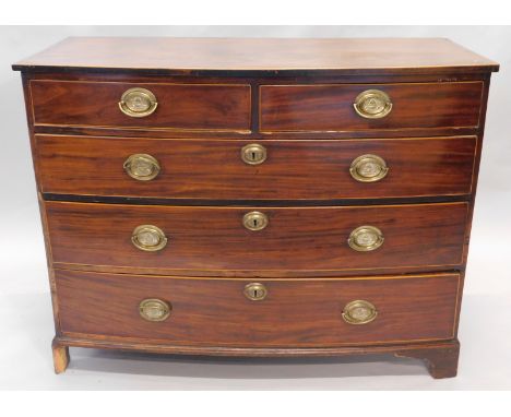 An early 19thC mahogany bow front chest, of two short and three long drawers, each with plate back handles, surmounted by an 