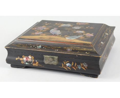 A Japanese box, with a  black lacquered and mother of pearl lid, with compressed dome top, six further boxes partially decora