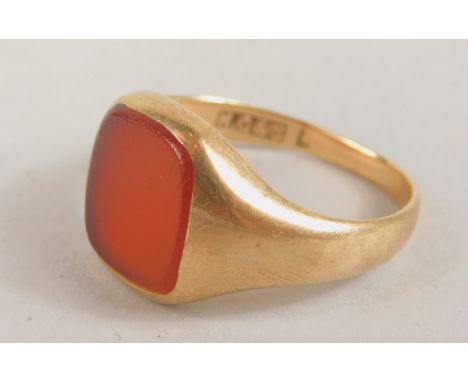 A 9ct gold signet ring, set with orange rectangular agate stone, (AF), 4.3 grams all in