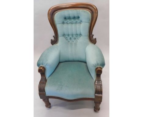 A Victorian walnut spoon back armchair, the back arms and serpentine seat (later) turquoise button back material on turned fr