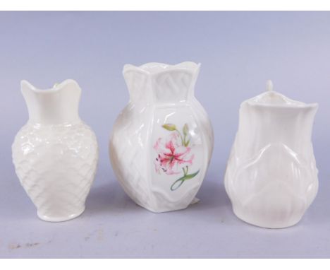 Three various 20thc Belleek items, comprising a vase decorated with flowers, 10cm high and two jugs, various green dog and ha