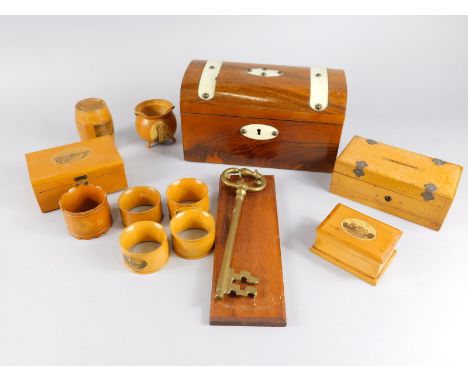 Various Mauchline ware, to include barrel shaped Bude money box, 7cm high, casket, napkin rings, cauldron, a polished rosewoo
