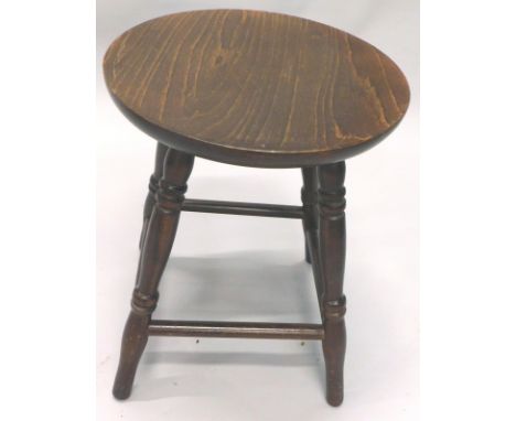 A 20thC stained beech oak finish stool, the circular top raised on ring turned supports joined by cylindrical stretchers, 43c