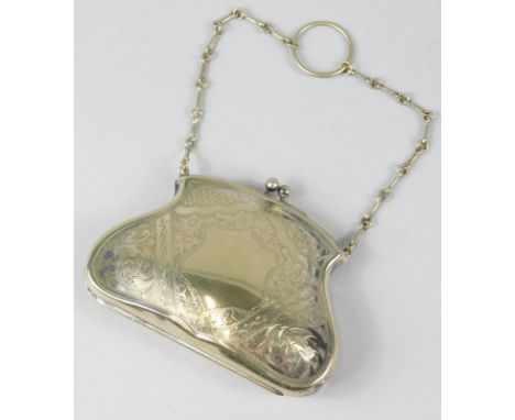 An Edwardian ladies silver plated evening purse, with chain and ring handle, orb clasp partially chased with a vacant shield 