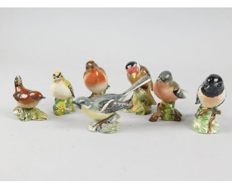 Seven Beswick ceramic birds, grey Wagtail, Chaffinch, Stone chat, Robin, Goldfinch, Golden Crest and Wren