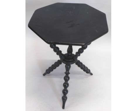 A late 19thC ebonised gypsy type table, the octagonal top on quadruple bobbin twist supports, 62cm high, 48cm wide, 49cm deep