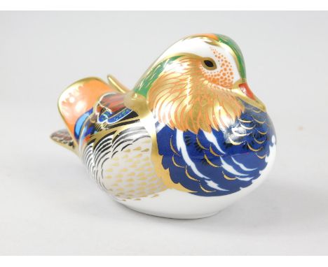 A Royal Crown Derby porcelain duck paperweight, silver button