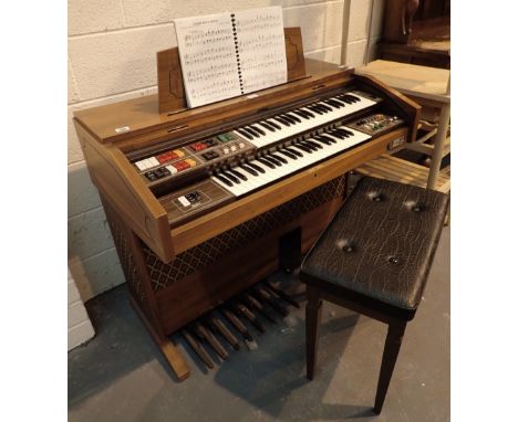 Gem electric organ in roll top cabinet with Leslie speaker complete with stool and quantity of music 
