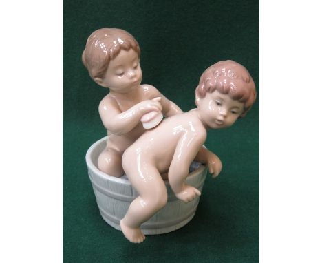 LLADRO GLAZED CERAMIC FIGURE GROUP OF TWO YOUNG BOYS GETTING WASHED 