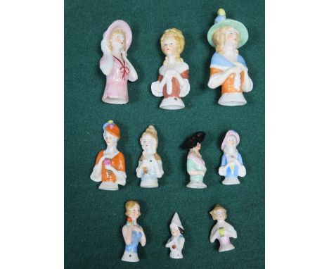 TEN VARIOUS HAND PAINTED CERAMIC PIN CUSHION DOLLS 