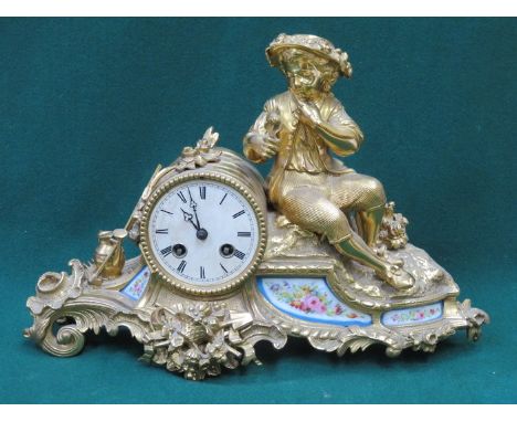 FRENCH STYLE GILT METAL FIGURE FORM MANTLE CLOCK WITH FLORAL DECORATED PORCELAIN PANELS, APPROXIMATELY 24.5cm HIGH