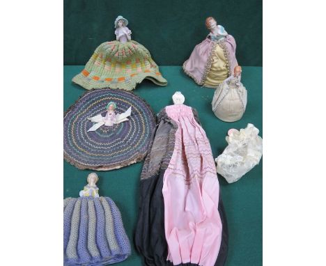 SEVEN VARIOUS HAND PAINTED CERAMIC PIN CUSHION DOLLS 