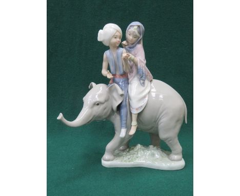 LLADRO GLAZED CERAMIC FIGURE GROUP OF BOY AND GIRL RIDING AN ELEPHANT 24cm