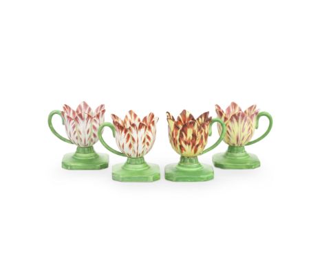 Four rare Spode pearlware tulip cups, circa 1820Each modelled as a single flower with variegated petals, green stalk handles 