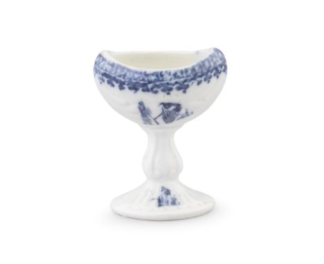 A Caughley eyebath, circa 1785-90The deep bowl and baluster stem moulded with scrolls, set on a reeded oval foot, printed in 