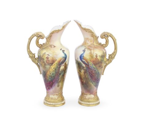 A pair of Royal Worcester Empress ewers by Walter Sedgley, dated 1918Of ovoid shape, with elaborate high scrolling handles pi