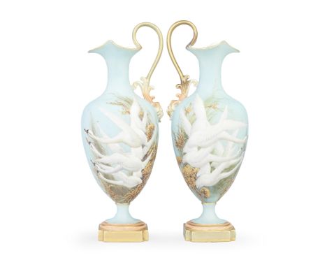 Two Royal Worcester ewers by Charley Baldwyn, dated 1907Of ovoid shape, the high scroll handles with a mask head at the lower
