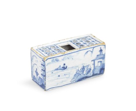 An English delftware flower brick, circa 1750Of small size, painted in blue with a Chinese riverscape, a figure in a rowboat 