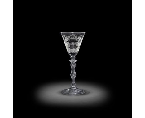 A good Dutch engraved light baluster 'Friendship' wine glass, circa 1750The round funnel bowl decorated with a pair of claspe