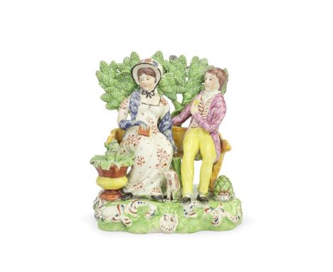 A Staffordshire group of 'Persuasion', circa 1820Modelled as gentleman proposing to a lady with a ring, both seated on a benc