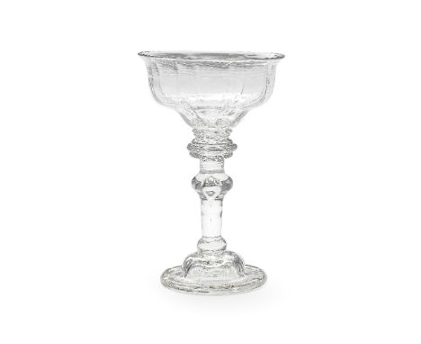 A good baluster sweetmeat glass, circa 1730The panel-moulded lipped double ogee bowl resting on a double collar, the stem wit